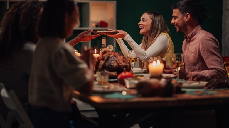 passing food around holiday table