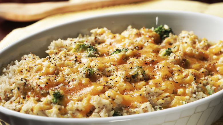 Chicken and rice casserole with broccoli florets closeup.