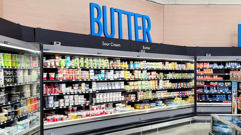 Walmart dairy section with butter sign.
