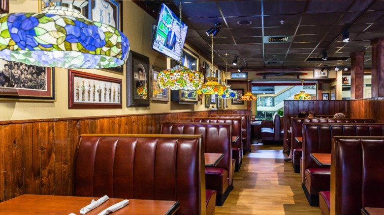 Interior of restaurant with retro-style stained glass lamps.