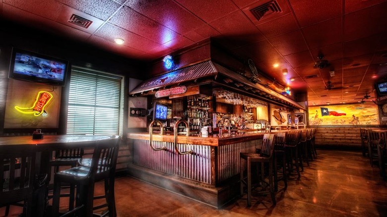 steakhouse interior with neon lights and full bar
