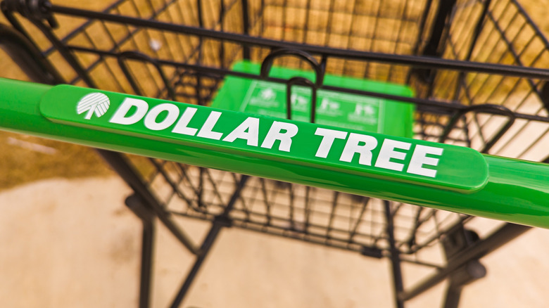 Closeup of Dollar Tree-branded shopping cart handle.