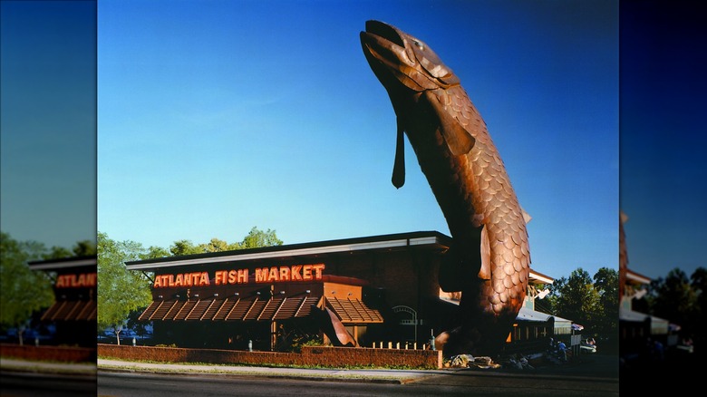 the exterior of atlanta fish market with fish statue