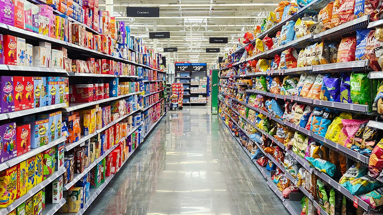 Snack aisle in Walmart showing many different products.