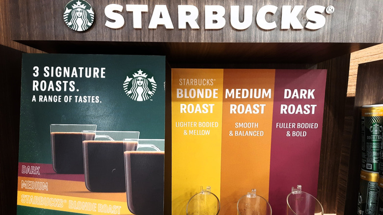 Starbucks display showing three different bean roasts.