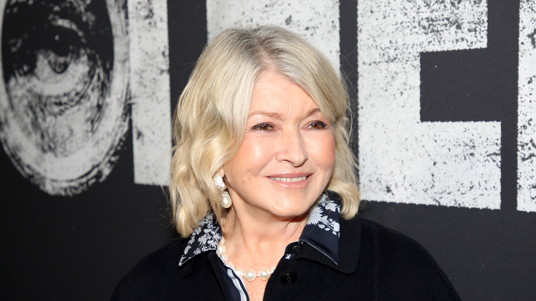 Martha Stewart smiling on red carpet.