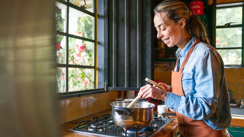 woman cooking in kitchen