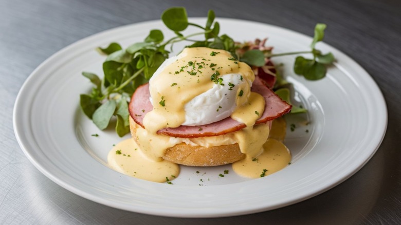 eggs benedict on white plate