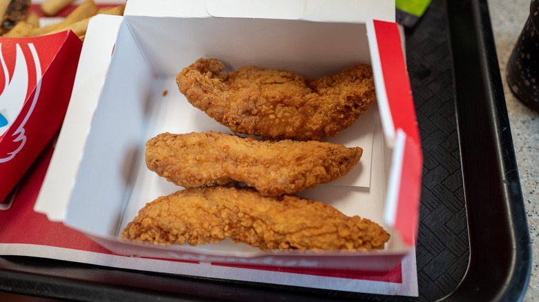 fast food fried chicken strips in open box