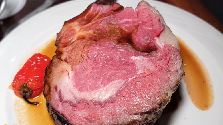 Closeup of prime rib from Keens Steakhouse, on white plate