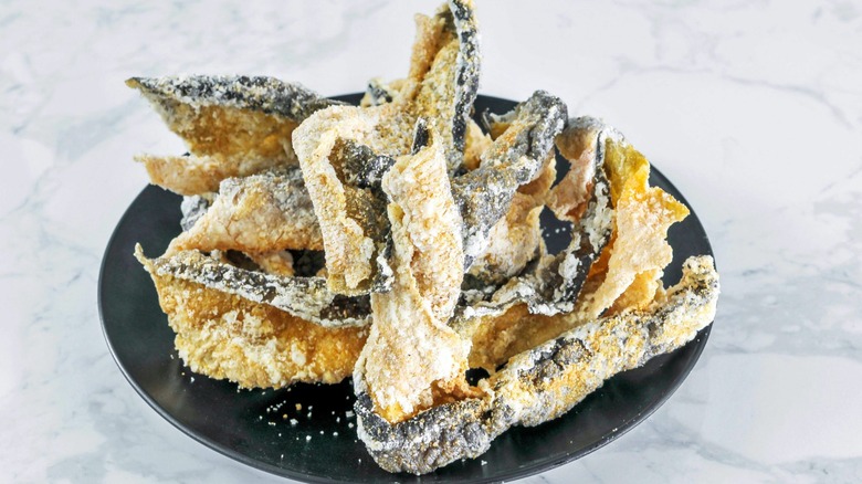 fried salmon skin snacks on plate