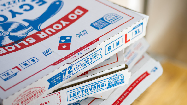 Domino's pizza boxes stacked