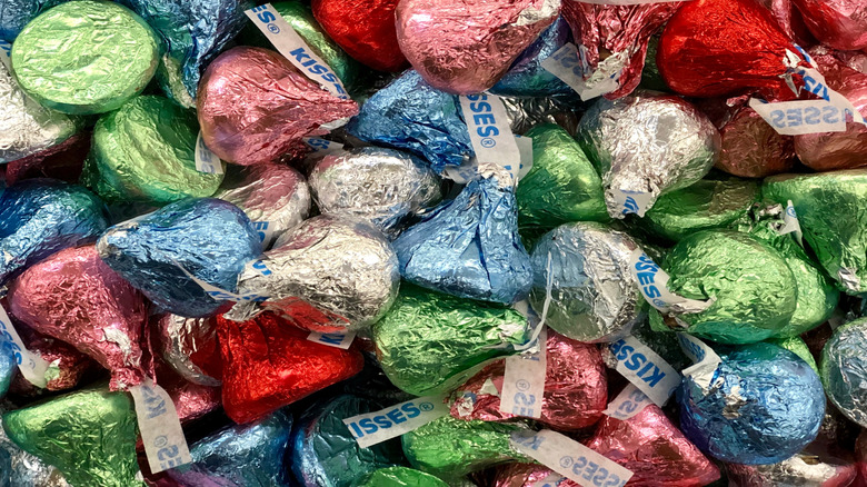 Closeup of many colorful foil-wrapped Hershey's Kisses