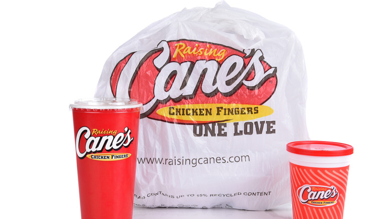 Raising Cane's takeout bag and cups.