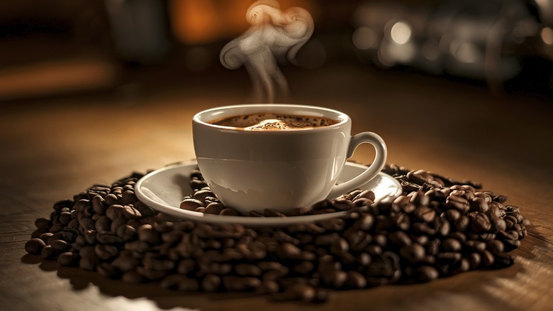 cup of coffee with coffee beans