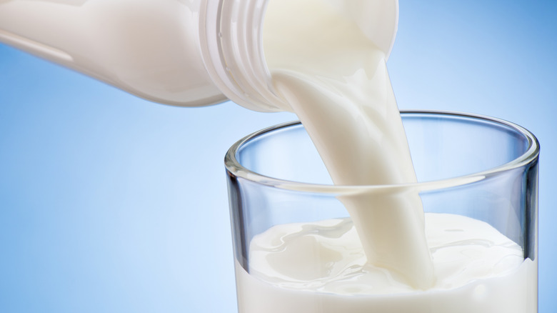 Close-up of milk being poured into a glass