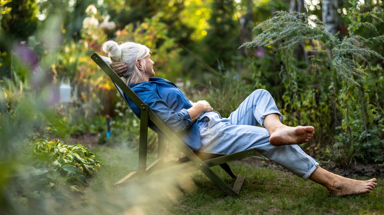 Woman relaxing in her garden