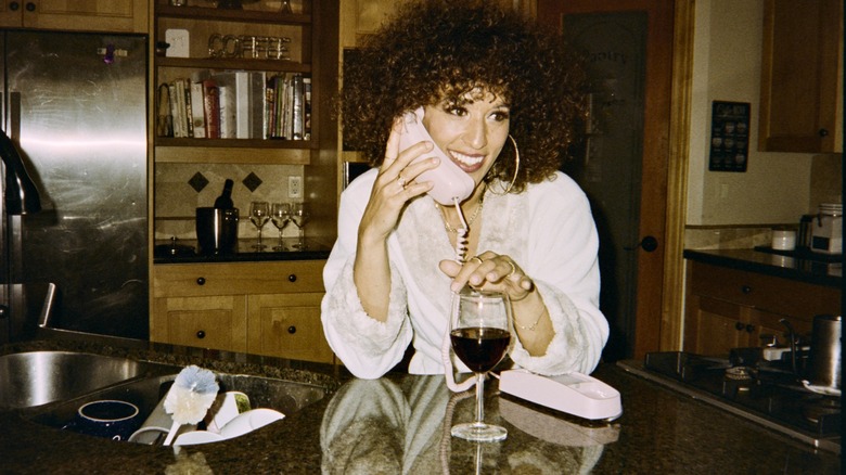 80s woman in old-fashioned kitchen