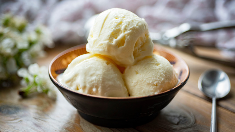 Three scoops of vanilla ice cream in bowl