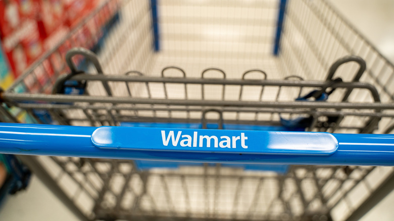 A close-up of the handle on a Walmart shopping cart