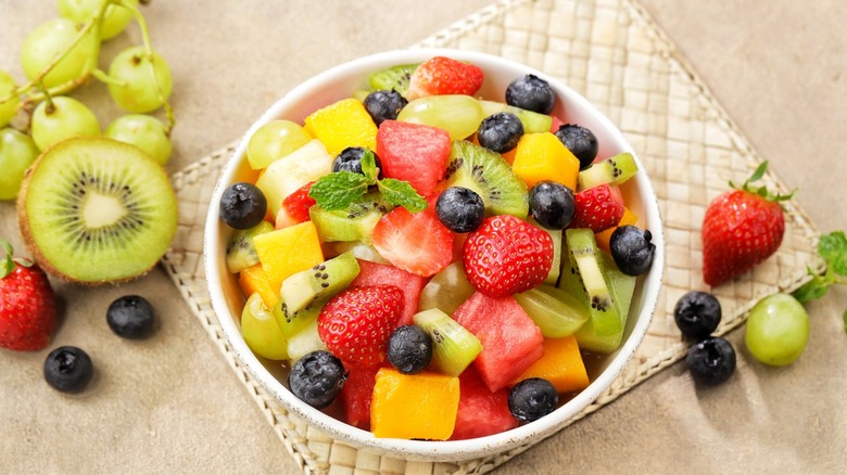 summer fruits in a bowl cut up into a salad
