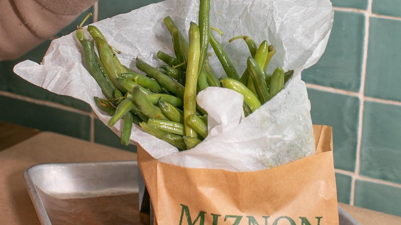 sauteed green beans in a paper bag