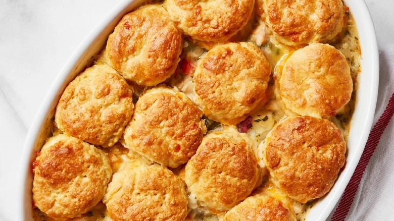 baking dish of chicken pot pie with a biscuit topping