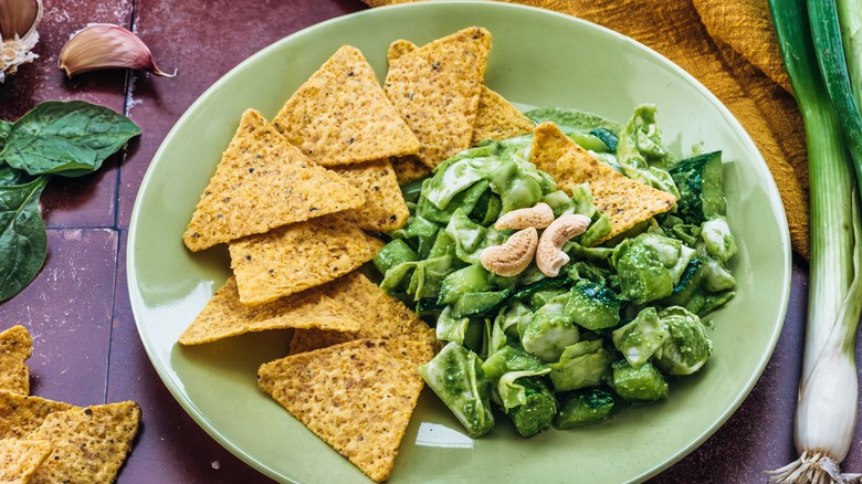 green goddess salad dip on a plate with tortilla chips