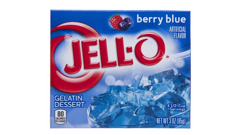 Box of berry blue jell-o mix on white background