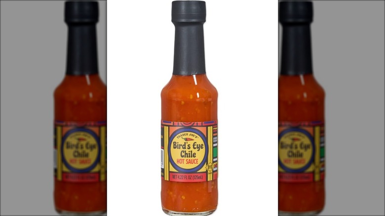 red hot sauce in glass bottle