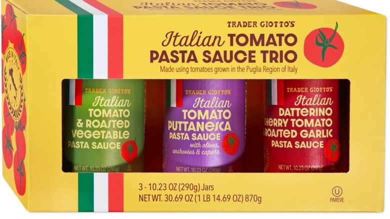 yellow box of three tomato sauce jars with colored labels