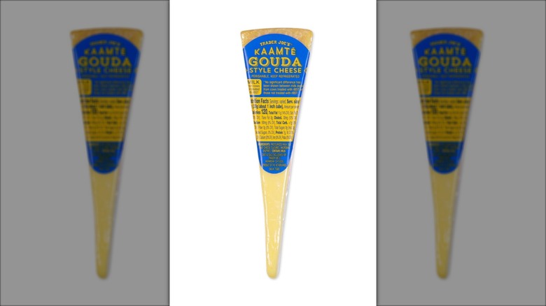 narrow wedge of gouda cheese with blue label