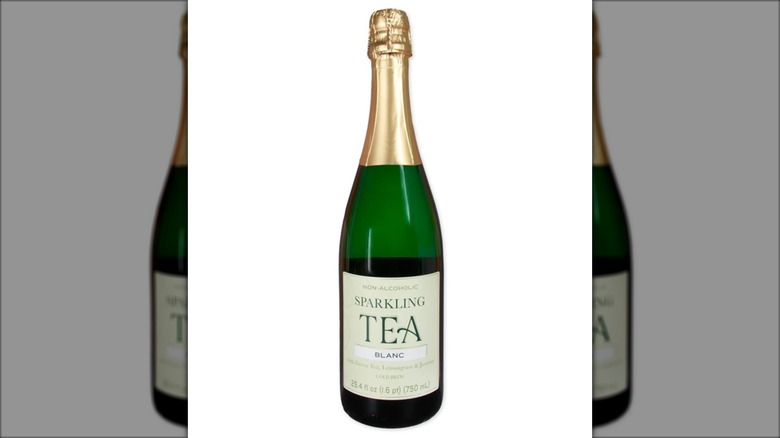 green bottle of sparkling tea with gold wrapper