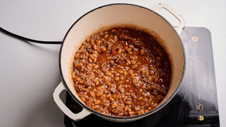 tomato sauce and beans added to pot