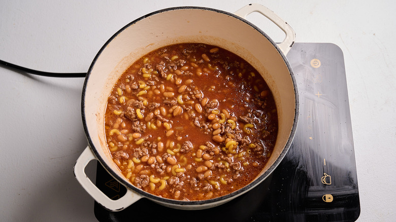 Water and macaroni noodles added to pot