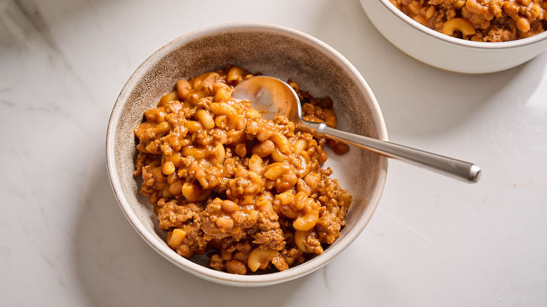 Chili mac in a bowl with a spoon