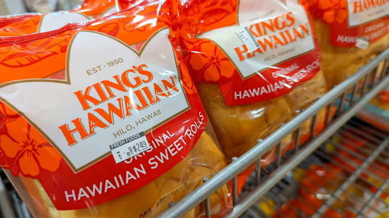 Packages of King's Hawaiian rolls on a grocery store shelf