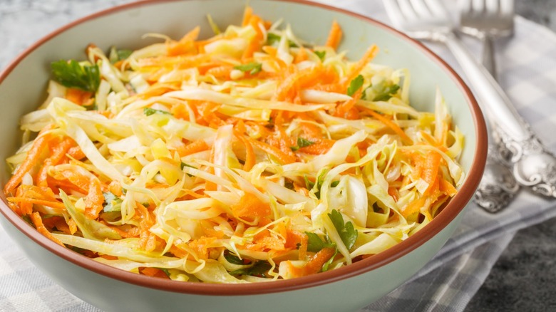 greek lahanosalata in a bowl with forks