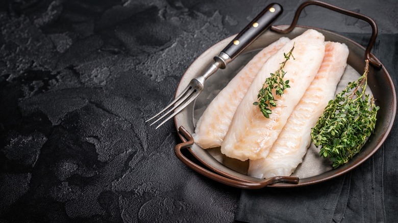 white fish filets on pan