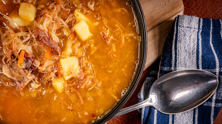 Soup with cabbage spoon on side