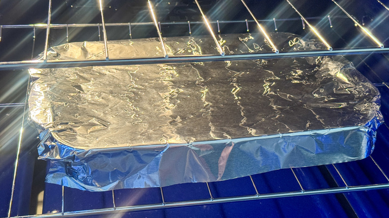 foil covered pan in oven