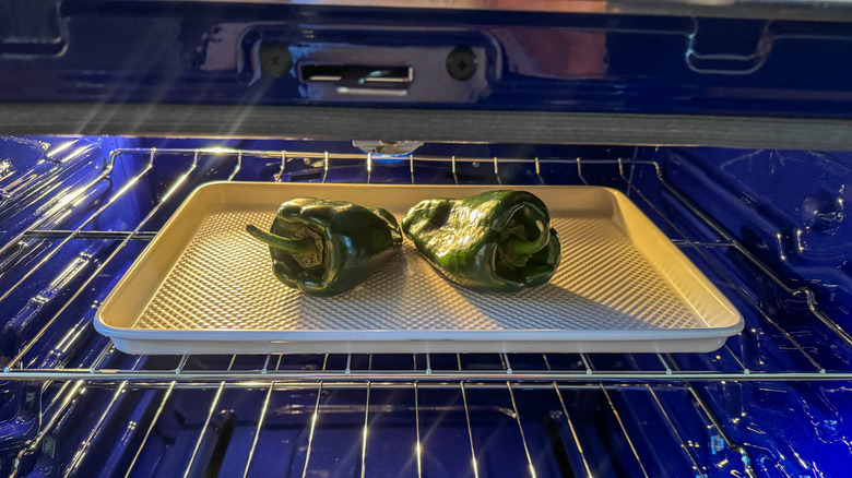 poblanos on baking sheet in oven
