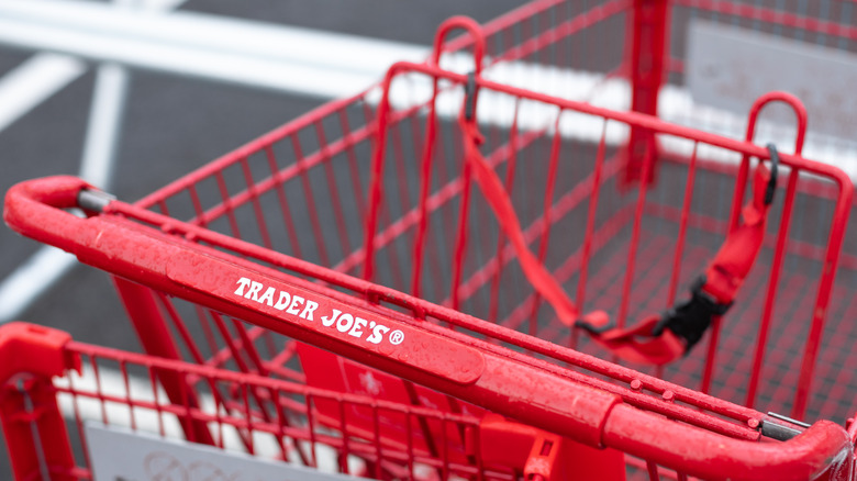 red handle of empty trader joe's cart