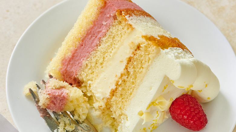 Wegmans lemon raspberry layer cake slice on white plate