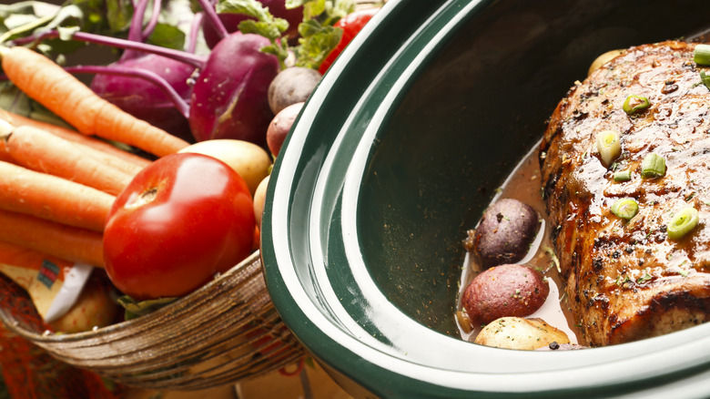 pork in slow cooker and veggie basket