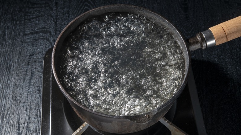 Water boiling in metal pot