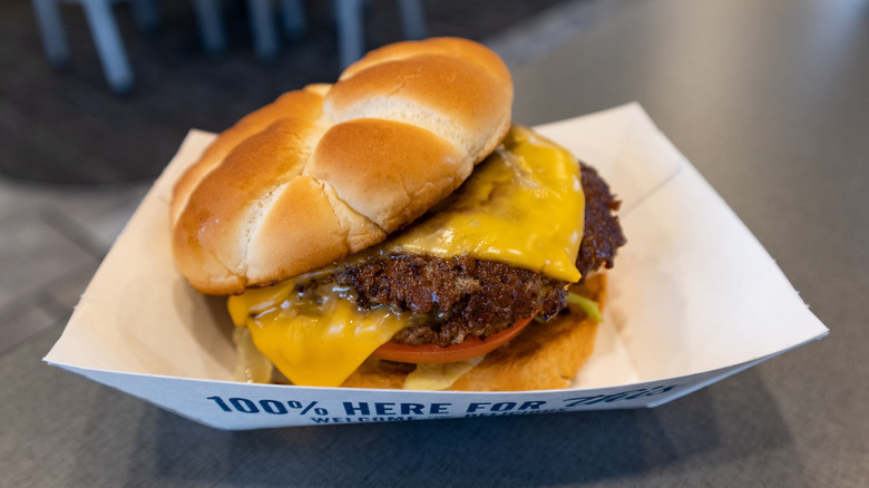 A Culver's butter burger sits in a cardboard tray