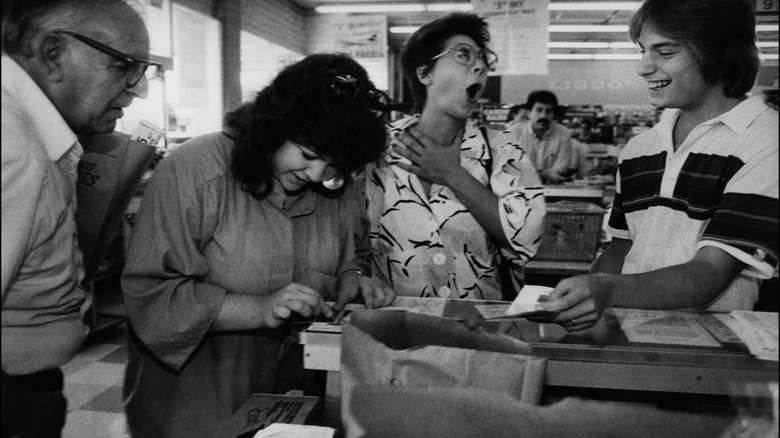 a customer plays a lotto ticket in a grocery store in the 80s