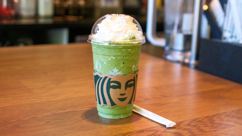 Green tea beverage on Starbucks counter