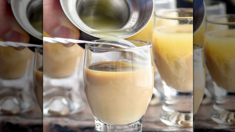 Lime juice pouring over spoon into Irish cream